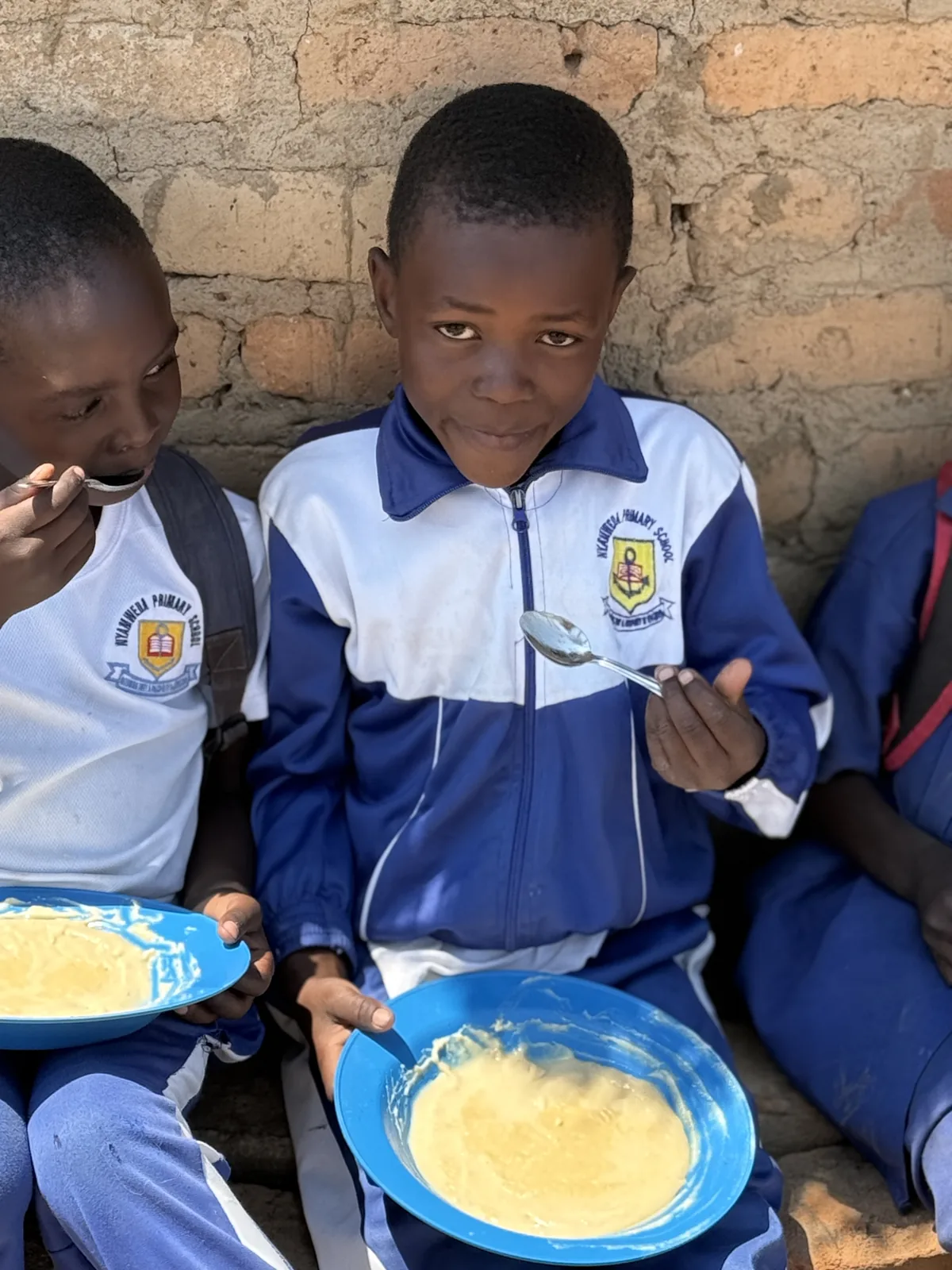 Schoolchildren sharing a meal.